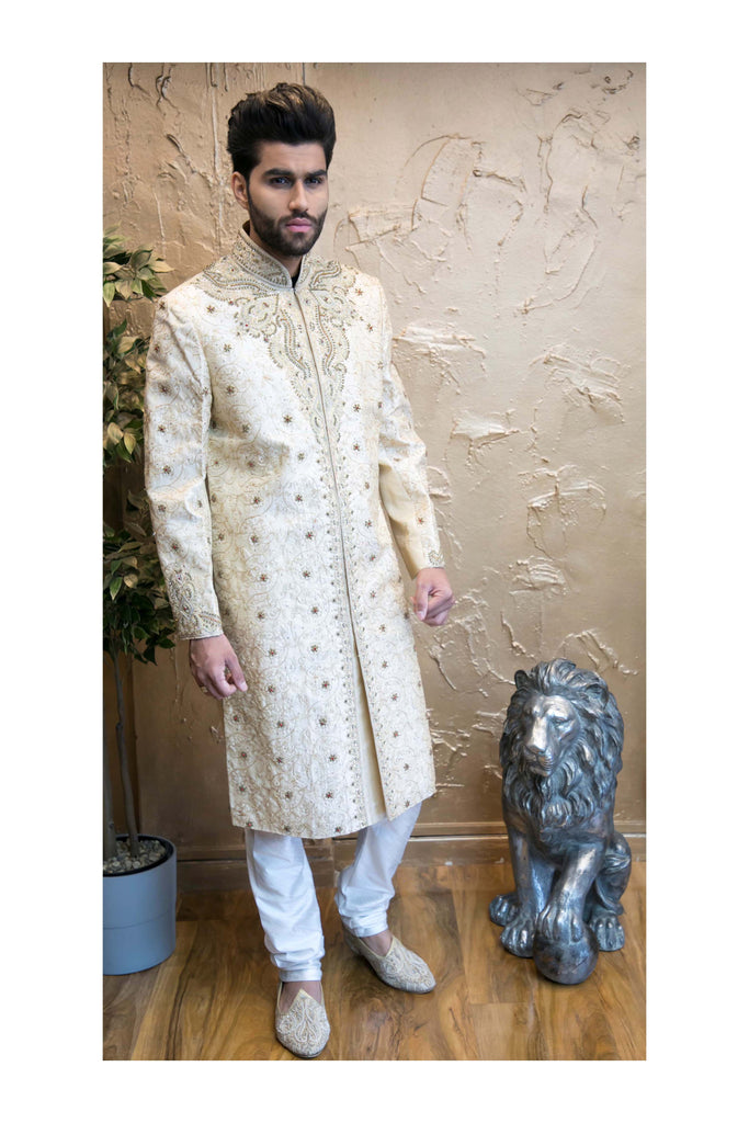 Gold Sherwani with Heavy Chest Piece Red Detailing